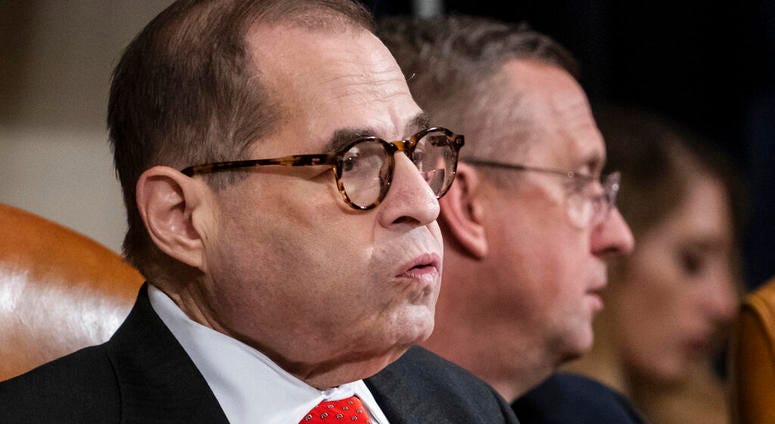 House Judiciary Committee Chairman Jerrold Nadler, D-N.Y., left, exhales after a day of work with Rep. Doug Collins, R-Ga., the ranking member, right, on the markup of articles of impeachment against President Donald Trump