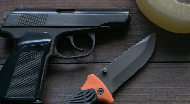 criminal news equipment. gun, knife, duct tape - stock photo