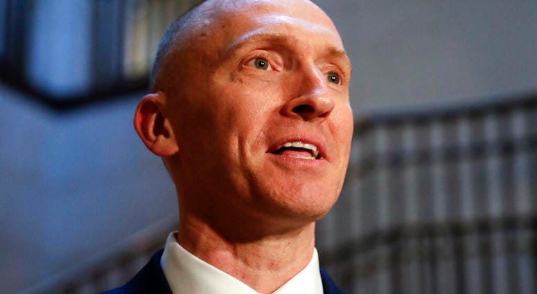 In this Nov. 2, 2017, photo, Carter Page, a foreign policy adviser to Donald Trump's 2016 presidential campaign, speaks with reporters following a day of questions from the House Intelligence Committee, on Capitol Hill in Washington.