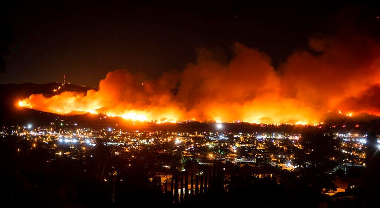 In this Oct. 31, 2019, file photo, smoke from the Maria Fire billows above Santa Paula, Calif.