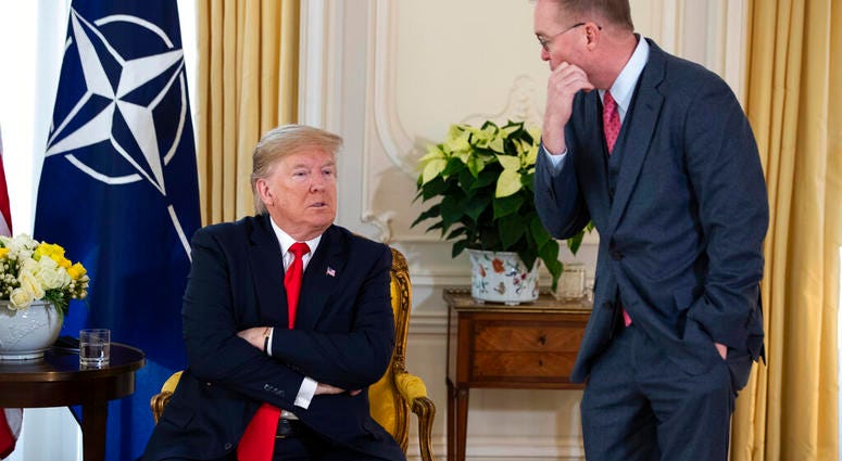 White House chief of staff Mick Mulvaney talks with US President Donald after his meeting with NATO Secretary General Jens Stoltenberg at Winfield House, Tuesday, Dec. 3, 2019, in London.