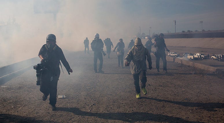 Tear Gas, migrant Caravan Tear Gas, migrant Caravan