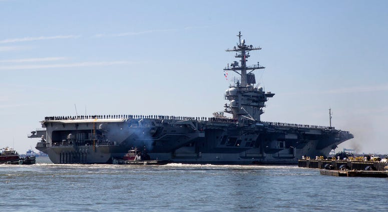 USS Abraham Lincoln the USS Abraham Lincoln deploys from Naval Station Norfolk