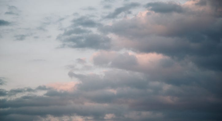 Gray color clouds partly cover the sky Gray color clouds partly cover the sky