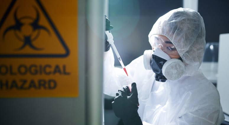 laboratory scientist in protective workwear, laboratory scientist in protective workwear,