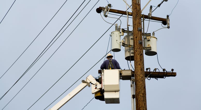 Power company worker, Repairing wires Power company worker, Repairing wires