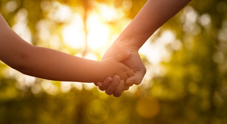 Mother's and a child hands Mother's and a child hands