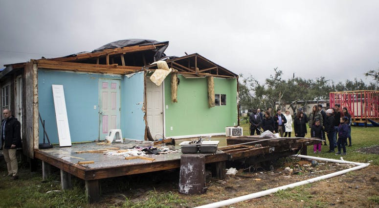 First lady Melania Trump walks with members of a family whose home was damaged by Hurricane Harvey. First lady Melania Trump walks with members of a family whose home was damaged by Hurricane Harvey.