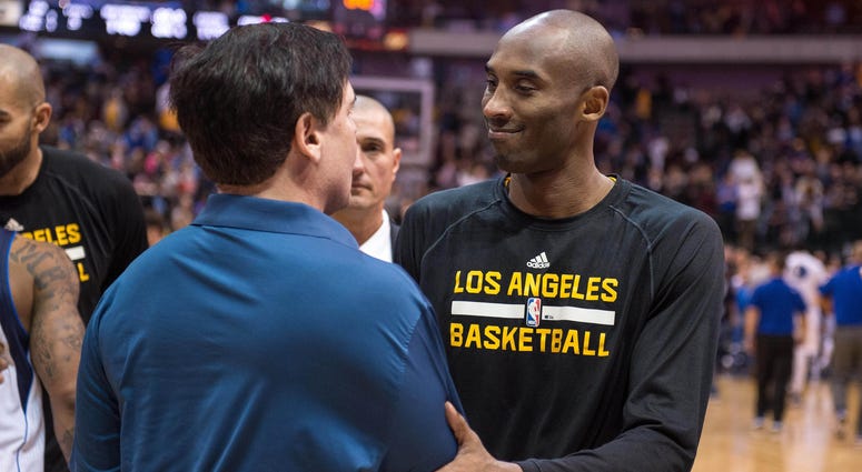 Los Angeles Lakers guard Kobe Bryant (24) greets Dallas Mavericks owner Mark Cuban Los Angeles Lakers guard Kobe Bryant (24) greets Dallas Mavericks owner Mark Cuban