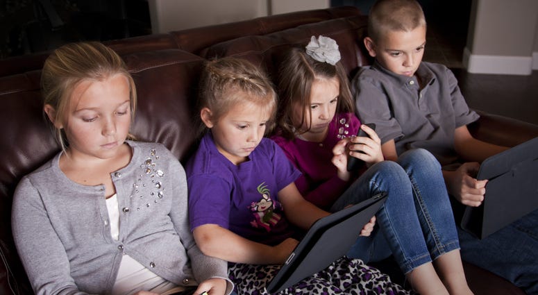 Kids using Mobile Devices Kids using Mobile Devices