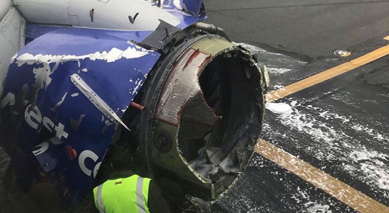 The engine on a Southwest Airlines plane is inspected as it sits on the runway at the Philadelphia International Airport after it made an emergency landing in Philadelphia The engine on a Southwest Airlines plane is inspected as it sits on the runway at the Philadelphia International Airport after it made an emergency landing in Philadelphia
