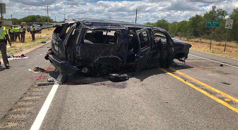 In this image tweeted by David Caltabiano of KABB/WOAI, a heavily damaged SUV is seen on Texas Highway 85 in Big Wells, Texas, after crashing while carrying more than a dozen people fleeing from Border Patrol agents In this image tweeted by David Caltabiano of KABB/WOAI, a heavily damaged SUV is seen on Texas Highway 85 in Big Wells, Texas, after crashing while carrying more than a dozen people fleeing from Border Patrol agents
