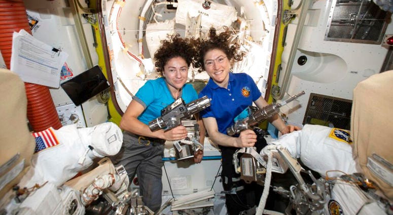 U.S. astronauts Jessica Meir, left, and Christina Koch pose for a photo in the International Space Station U.S. astronauts Jessica Meir, left, and Christina Koch pose for a photo in the International Space Station