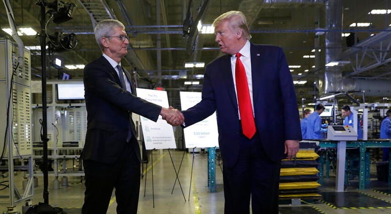 Apple CEO Tim Cook and President Donald Trump Apple CEO Tim Cook and President Donald Trump
