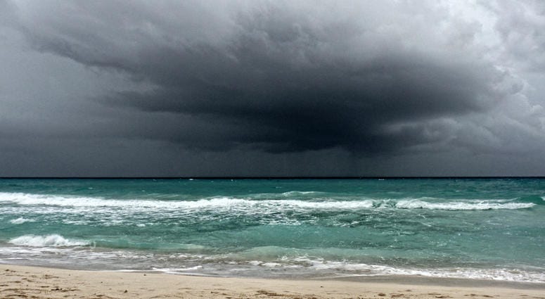 View of a storm on the ocean View of a storm on the ocean