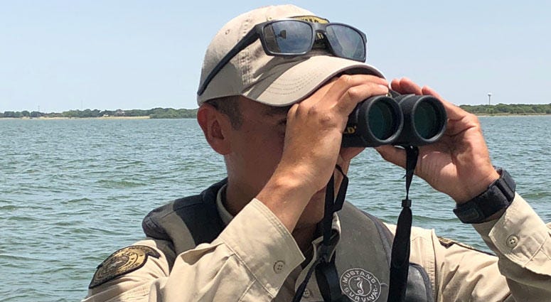 Lewisville Lake/Denton County game warden Josh Espinoza looks for boating safety problems on Lewisville Lake Lewisville Lake/Denton County game warden Josh Espinoza looks for boating safety problems on Lewisville Lake
