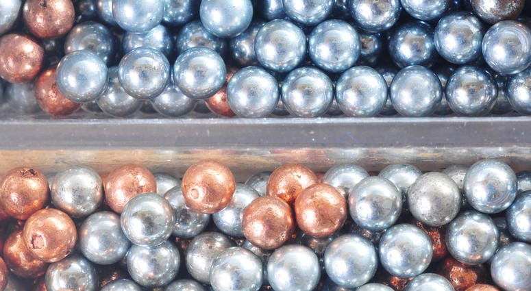 Macro shot of a container with tiny bb's for air guns Macro shot of a container with tiny bb's for air guns