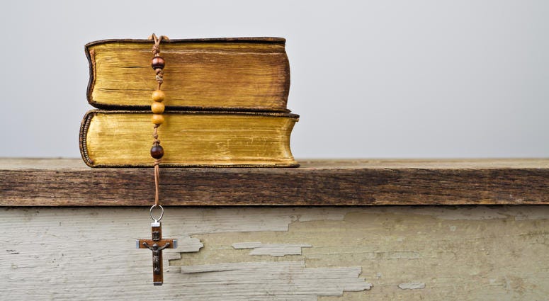 Rosary beads, Catholic Church liturgy Rosary beads and books of Catholic Church liturgy