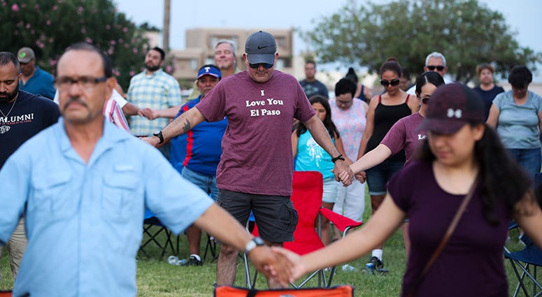 People take part in a prayer and vigil at Ponder Park in El Paso, Texas, People take part in a prayer and vigil at Ponder Park in El Paso, Texas,