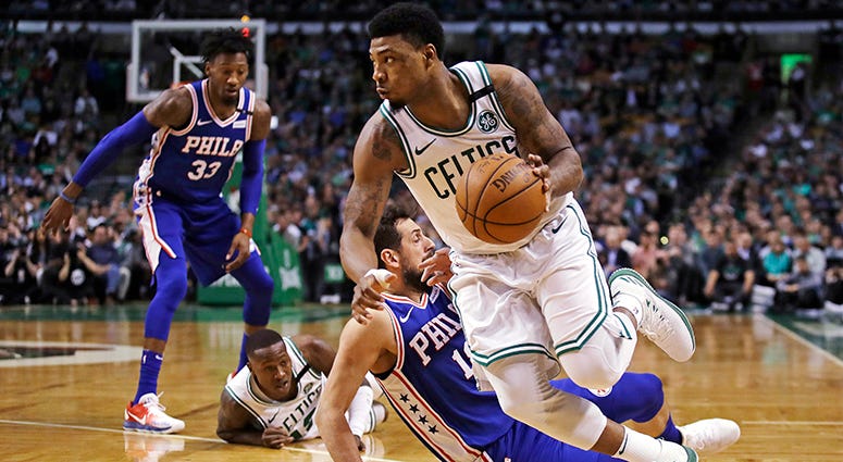 Boston Celtics guard Marcus Smart, right, drives past Philadelphia 76ers guard Marco Belinelli during the first quarter of Game 5 of an NBA basketball playoff series in Boston, Boston Celtics guard Marcus Smart, right, drives past Philadelphia 76ers guard Marco Belinelli during the first quarter of Game 5 of an NBA basketball playoff series in Boston,