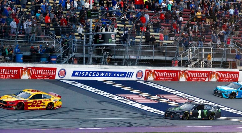 NASCAR, Joey Logano Joey Logano (22) defeats Kurt Busch (1) and Martin Truex Jr. (19) to win a NASCAR Cup Series auto race at Michigan International Speedway