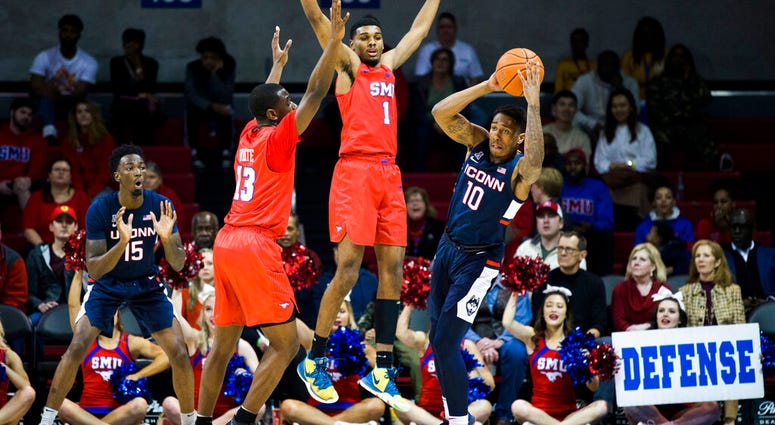 UConn vs SMU SMU forward Feron Hunt (1) and guard CJ White (13) defend against Connecticut guard Brendan Adams (10) during the first half of an NCAA college basketball game Wednesday, Feb. 12, 2020, in Dallas.