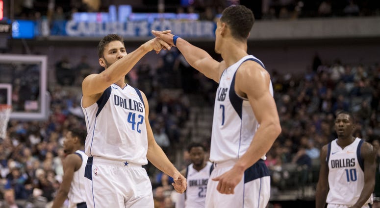 Utah Jazz at Dallas Mavericks Dallas Mavericks forward Maximilian Kleber (42) and forward Dwight Powell (7) celebrate during the second quarter against the Utah Jazz at the American Airlines Center.