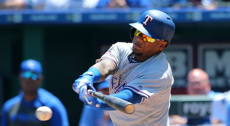 May 16, 2019; Kansas City, MO, USA; Texas Rangers left fielder Willie Calhoun (5) hits an RBI single against the Kansas City Royals in the fifth inning at Kauffman Stadium. May 16, 2019; Kansas City, MO, USA; Texas Rangers left fielder Willie Calhoun (5) hits an RBI single against the Kansas City Royals in the fifth inning at Kauffman Stadium.