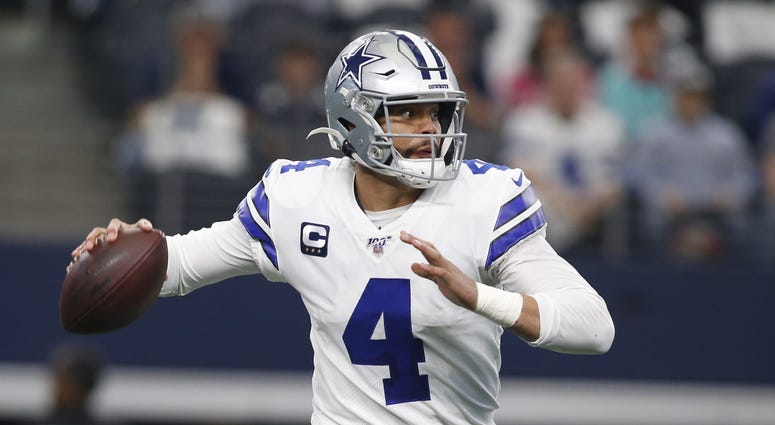 Dec 29, 2019; Arlington, Texas, USA; Dallas Cowboys quarterback Dak Prescott (4) rolls out in the first quarter against the Washington Redskins at AT&T Stadium Dec 29, 2019; Arlington, Texas, USA; Dallas Cowboys quarterback Dak Prescott (4) rolls out in the first quarter against the Washington Redskins at AT&T Stadium