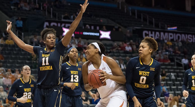 NCAA Womens Basketball: Big 12 Conference Tournament Texas Longhorns forward Jatarie White (40) pulls up to shoot against West Virginia Mountaineers forward Teana Muldrow (11) during the fourth quarter during the women's Big 12 Conference Tournament at Chesapeake Energy Arena.