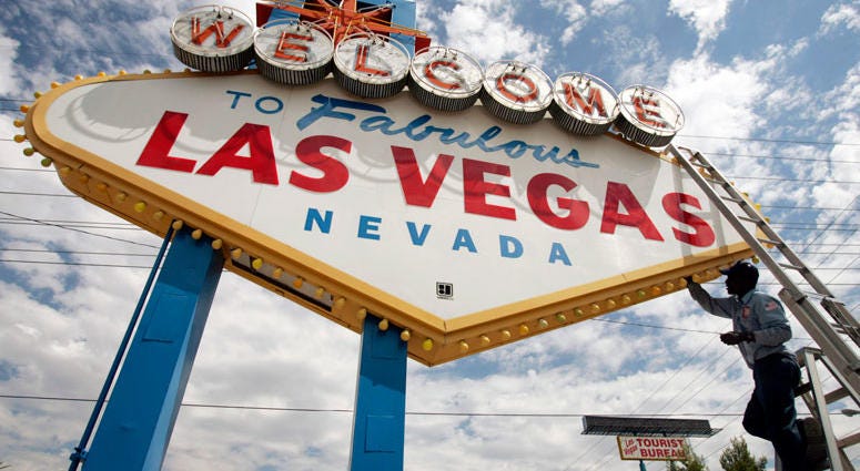 FILE - In this July 28, 2005, file photo, an electric company worker changing ballasts and lamps on the "Welcome to Las Vegas," sign in Las Vegas. FILE - In this July 28, 2005, file photo, an electric company worker changing ballasts and lamps on the "Welcome to Las Vegas," sign in Las Vegas.
