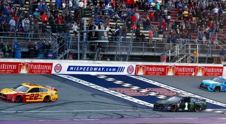 NASCAR, Joey Logano Joey Logano (22) defeats Kurt Busch (1) and Martin Truex Jr. (19) to win a NASCAR Cup Series auto race at Michigan International Speedway