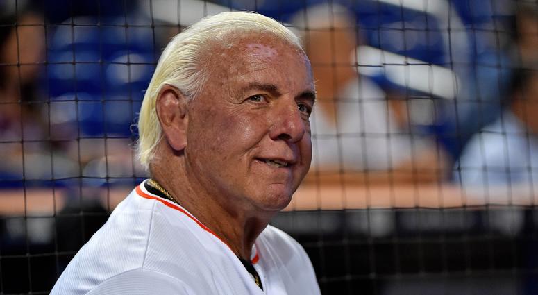 Jul 28, 2017; Miami, FL, USA; Former wrestling WCW and WWE wrestler Ric Flair warms up before throwing out the first pitch at Marlins Park prior to the game between the Cincinnati Reds and the Miami Marlins. Jul 28, 2017; Miami, FL, USA; Former wrestling WCW and WWE wrestler Ric Flair warms up before throwing out the first pitch at Marlins Park prior to the game between the Cincinnati Reds and the Miami Marlins.