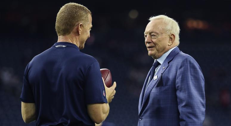 Dallas Cowboys head coach Jason Garrett (left) speaks with owner Jerry Jones (right) Jason Garrett, Jerry Jones