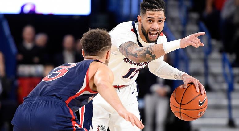 Josh Perkins Gonzaga Bulldogs guard Josh Perkins (13) brings the basketball down court against St. Mary's Gaels guard Jordan Ford