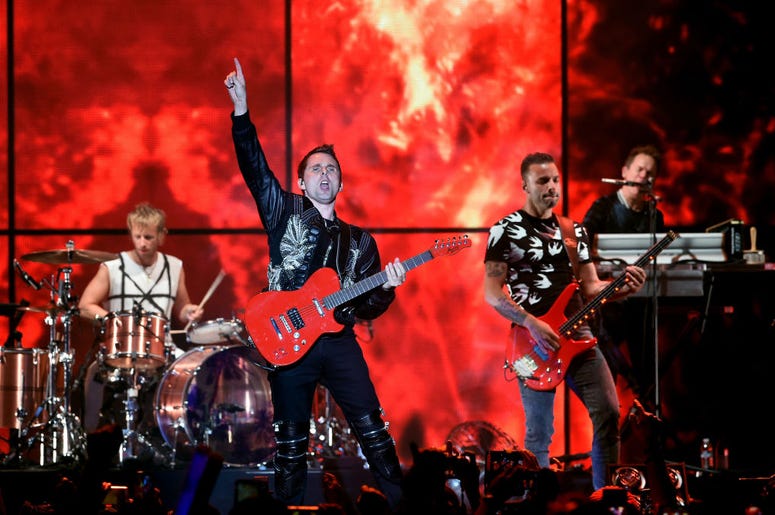 Dominic Howard, Matt Bellamy, and Chris Wolstenholme of Muse perform onstage during KROQ Almost Acoustic Christmas 2017 Dominic Howard, Matt Bellamy, and Chris Wolstenholme of Muse perform onstage during KROQ Almost Acoustic Christmas 2017