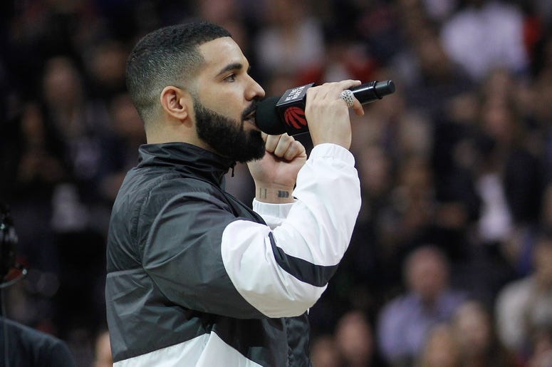 Mar 9, 2018; Toronto, Ontario, CAN; Canadian recording artist Drake addresses the Toronto Raptors fans during a break in the action against the Houston Rockets at the Air Canada Centre. Toronto defeated Houston 108-105.Mandatory Credit: John E. Sokolowski
