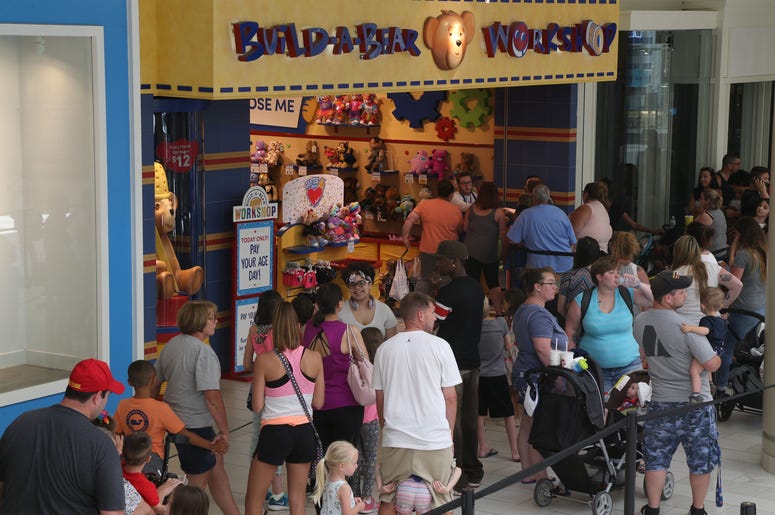 July 12, 2018; Poughkeepsie, NY, USA; Shoppers line up outside the Build-A-Bear Workshop in the Poughkeepsie Galleria. Build-A-Bear ran a promotion where customers pay their age for their bear, and the stores experienced extremely high volume as a result.