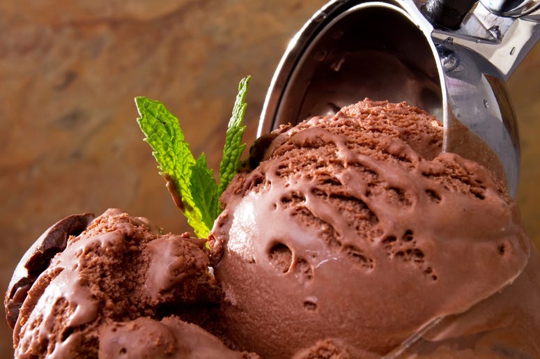 Delicious chocolate ice cream. Frozen, leaves.