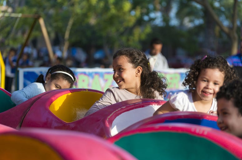 Happy Young Kids at Amusement Park