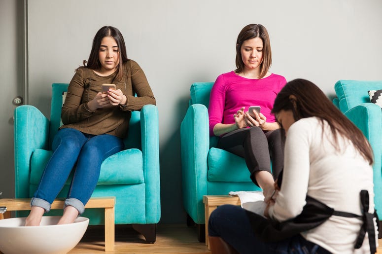 Using smartphones while getting a pedicure