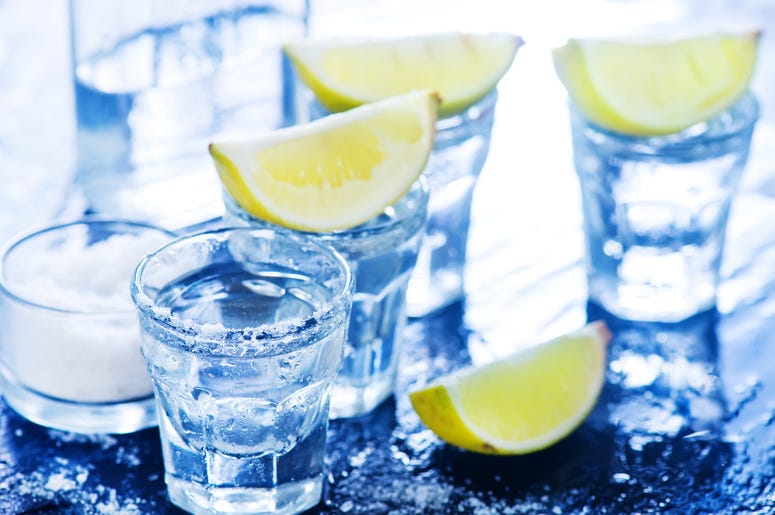 Tequilla with salt and lime on a table Tequilla with salt and lime on a table