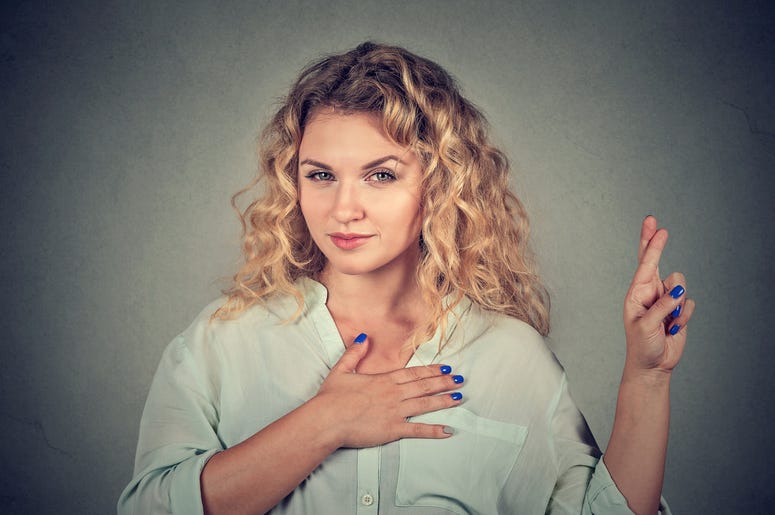 A liar young woman making a promise
