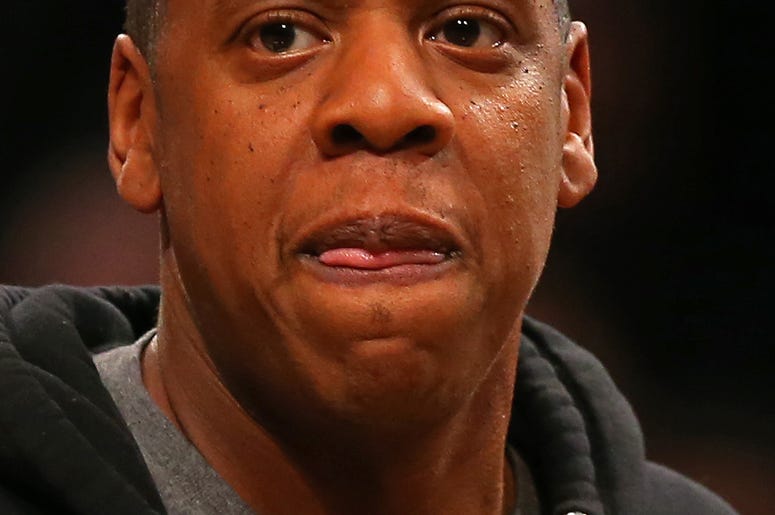 Jan 12, 2015; Brooklyn, NY, USA; Recording artist Jay-Z walks off the court after the Houston Rockets defeated the Brooklyn Nets at the Barclays Center. The Rockets defeated the Nets 113-99. Mandatory Credit: Adam Hunger-USA TODAY Sports