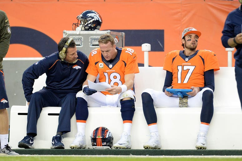 Nov 15, 2015; Denver, CO, USA; Denver Broncos quarterback Peyton Manning (18) talks with quarterback coach Greg Knapp following being benched along with quarterback Brock Osweiler (17) in the third quarter against the Kansas City Chiefs at Sports Authorit