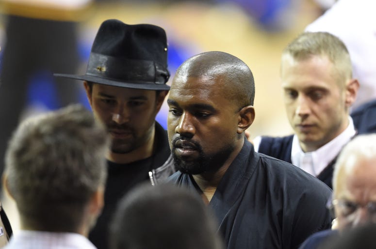 Jun 11, 2015; Cleveland, OH, USA; Recording artist Kanye West arrives prior to game four of the NBA Finals between the Cleveland Cavaliers and the Golden State Warriors at Quicken Loans Arena. Mandatory Credit: David Richard-USA TODAY Sports