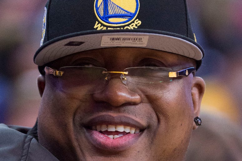 December 16, 2015; Oakland, CA, USA; Recording artist E-40 sits courtside during the second quarter between the Golden State Warriors and the Phoenix Suns at Oracle Arena. Mandatory Credit: Kyle Terada-USA TODAY Sports