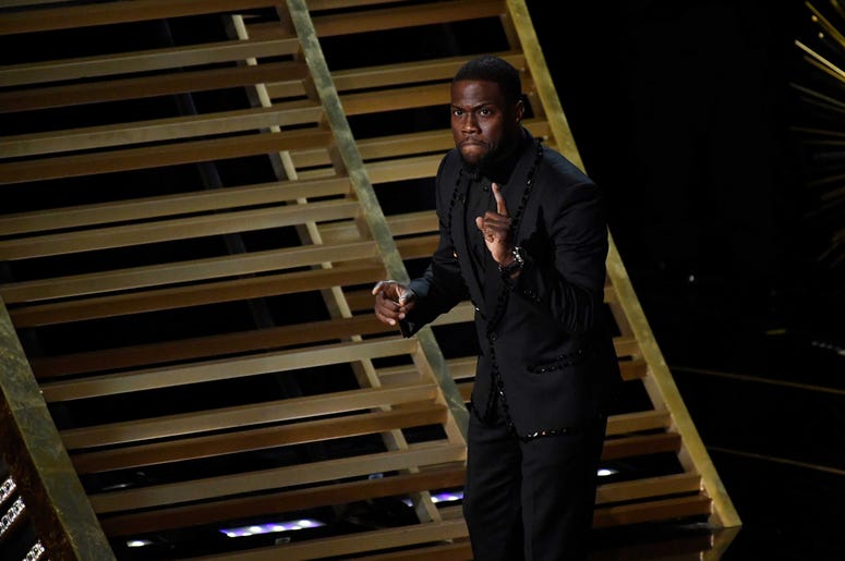 Feb 28, 2016; Hollywood, CA, USA; Kevin Hart introduces The Weeknd performing the Earned It from Fifty Shades of Grey during the 88th annual Academy Awards at the Dolby Theatre. Mandatory Credit: Robert Deutsch-USA TODAY NETWORK