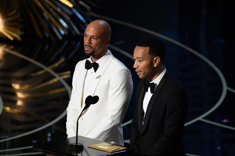 Feb 28, 2016; Hollywood, CA, USA; Common (left) and John Legend present the Oscar for Best Original Song during the 88th annual Academy Awards at the Dolby Theatre. Mandatory Credit: Robert Deutsch-USA TODAY NETWORK