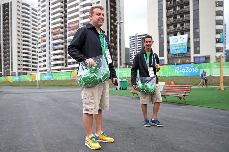 Jul 28, 2016; Rio de Janeiro, Brazil; Higor Leite hands out condoms in the international zone at Athlete Village. Mandatory Credit: Peter Casey-USA TODAY Sports